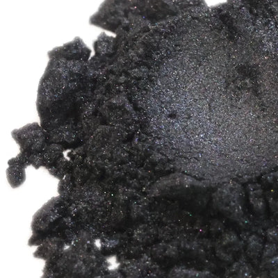 Mound of black mica powder with faint violet shimmer