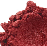 Close-up of red handmade cosmetic powder for nurturing skin.