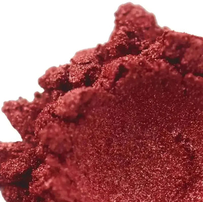 Heaped deep crimson red mica powder with metallic shimmer