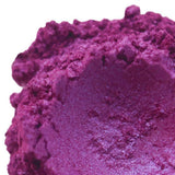 Close-up of vibrant purple handmade cosmetic powder, Nurture Handmade beauty product.