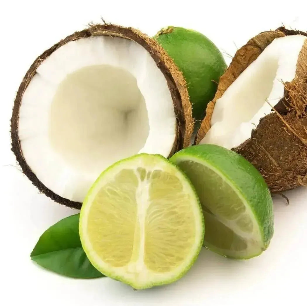Freshly halved coconut with lime slices for Coconut Lime Verbena Blend