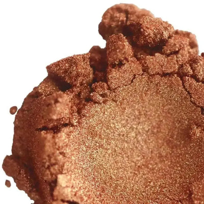 Mound of shimmering coppery orange-brown mica powder