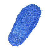 Blue glitter powder on a white background, perfect for handmade crafts and nurturing creativity.