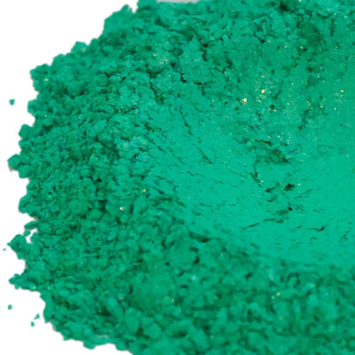 Mound of jade green mica powder with slight gold sparkle