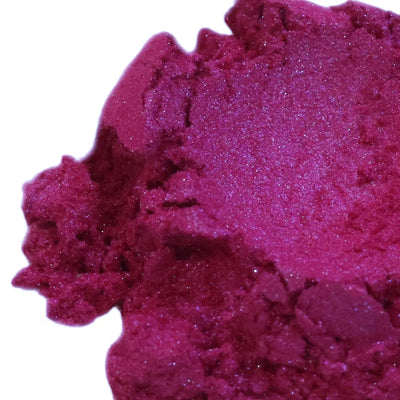 Mound of magenta mica powder with pinkish pearl shimmer