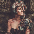 Woman in elaborate floral skull headpiece for Dryad Fragrance Blend