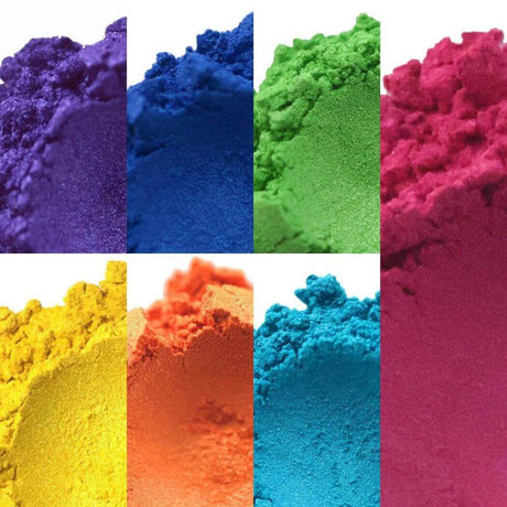 Rainbow colored powder pigments showcasing a vibrant spectrum for Nurture Handmade products.