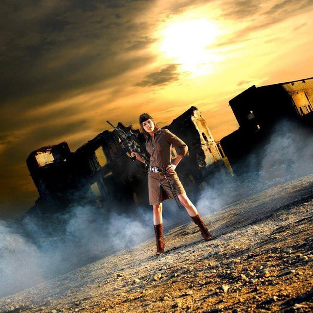 Person in military attire standing confidently in front of ruins amid smoky and dramatic skies at sunset