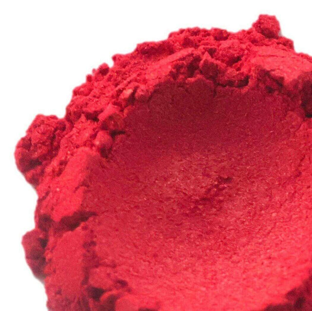 Close-up of vibrant red powdered pigment used in handmade crafts and artistic creations by Nurture Handmade.