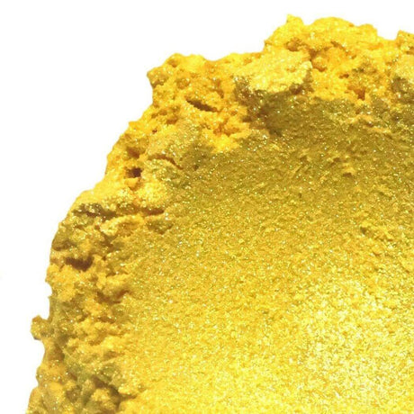 Close-up of vibrant yellow powdered pigment for handmade crafts and art projects with a textured, glittery finish.