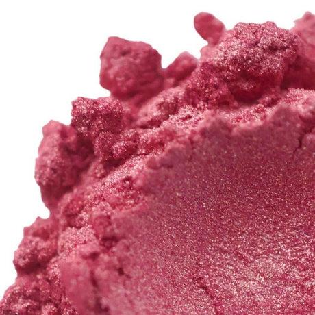 Close-up of pink handmade cosmetic powder with rough texture from Nurture Handmade