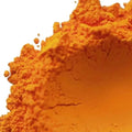 Vibrant fluorescent neon orange-yellow pigment powder with fine granular texture