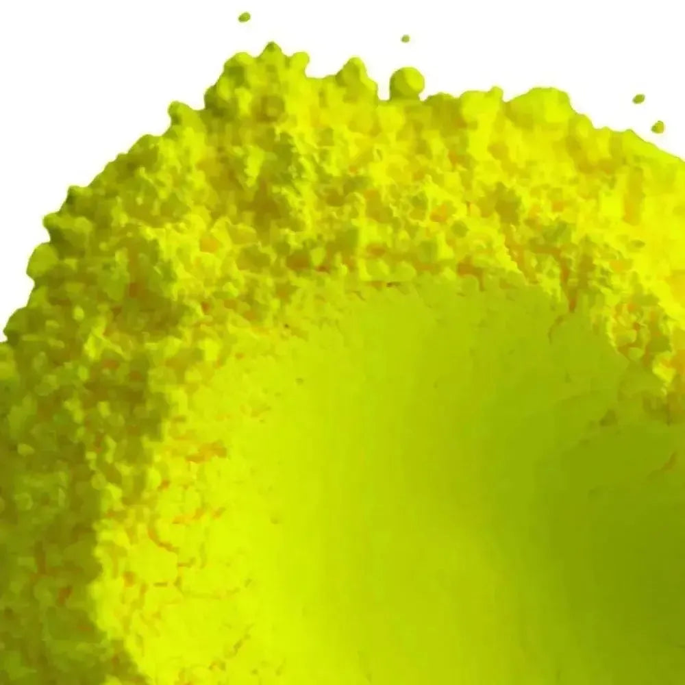 Vibrant finely textured mound of fluorescent neon yellow pigment