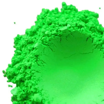 Mound of bright neon green mica powder on white
