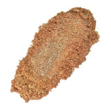 Nurture Handmade golden glitter powder swatch for cosmetics and crafts.