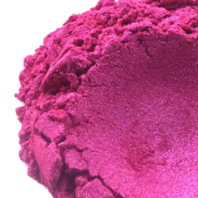 Heaped deep fuchsia mica powder with pearly shimmer