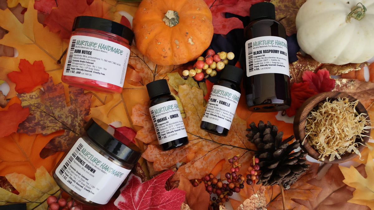 Nurture Handmade Burn Notice mica jar, fragrance oils and pumpkins on fall leaves