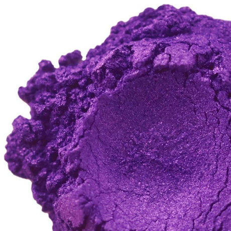 Close-up of vibrant purple handmade powder, Nurture Handmade product.