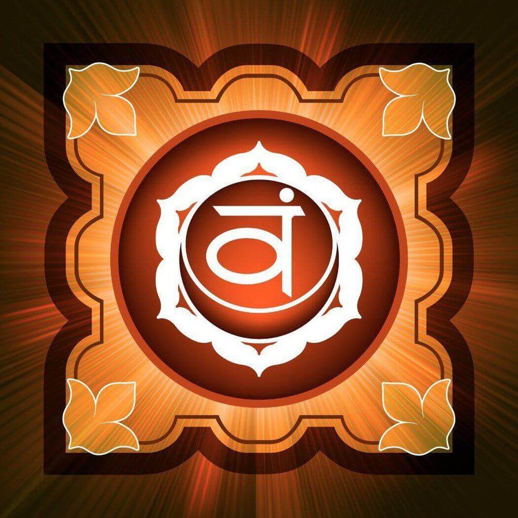 Sacral Chakra symbol in a radiant orange and brown design with floral accents, representing creativity and emotional balance.