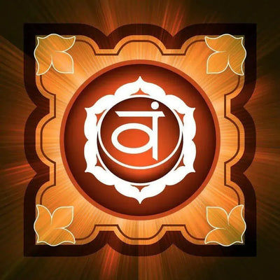 Orange sacral chakra emblem with Sanskrit vam inside white lotus