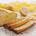 Golden-brown lemon loaf cake with moist crumb and zest flecks