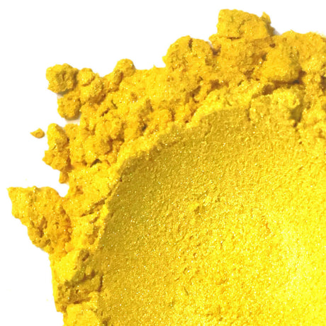 Nurture Handmade bright yellow pigment powder, close-up view.