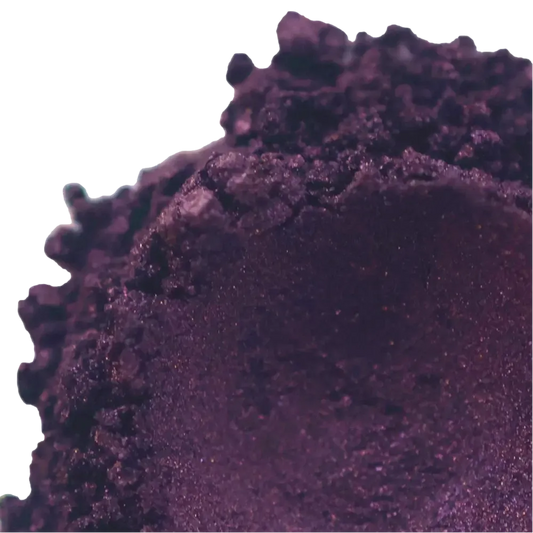 Close-up of Blackberry Dark Purple Mica powder with reddish-gold highlights for beauty and crafting projects.