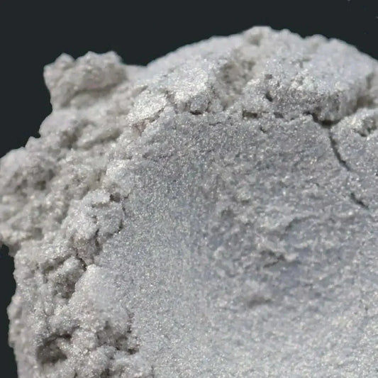 Close-up of shimmering Gold Enigma Mica showing a mesmerizing texture with gold flashes in different lighting.