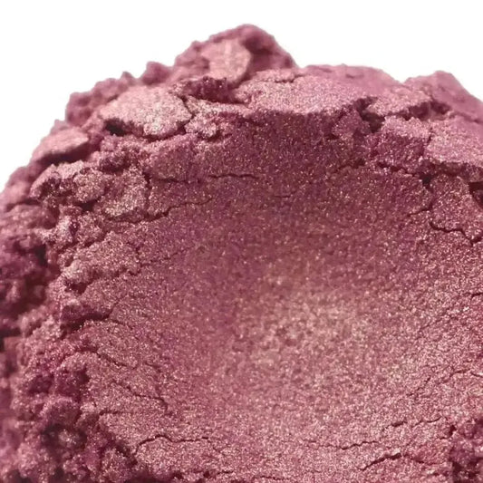 Close-up of Magic Moments Pink Mica powder showcasing its shimmering rose gold hue and golden undertones.