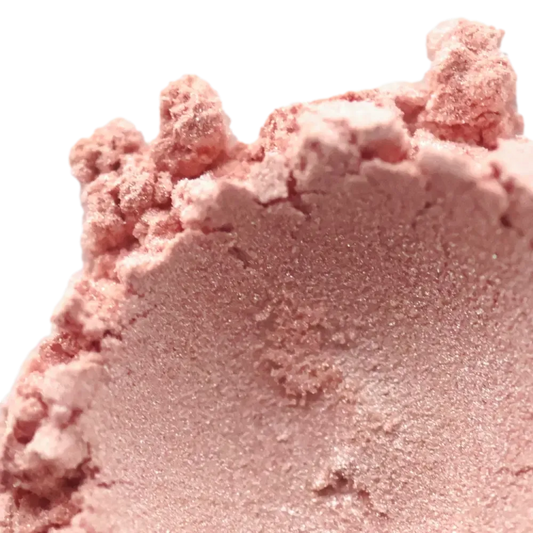 Close-up of Oleander Soft Pink Mica powder, showcasing its delicate peachy hue and shimmering texture for crafting.
