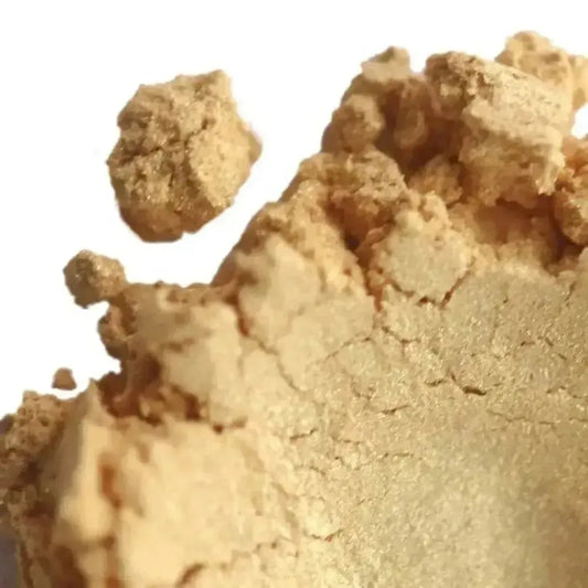 Close-up of Rapunzel Gold Mica powder showcasing its shimmering golden texture for crafts and beauty.