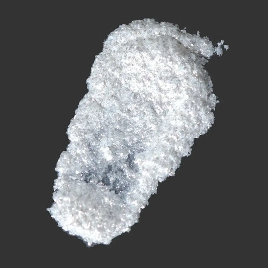 Super Sparkles White Mica Glitter in a mound, showcasing its dazzling eco-friendly shimmer and crushed diamond-like brilliance.