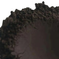 Rough black Brazilian natural clay rock formation with jagged edges