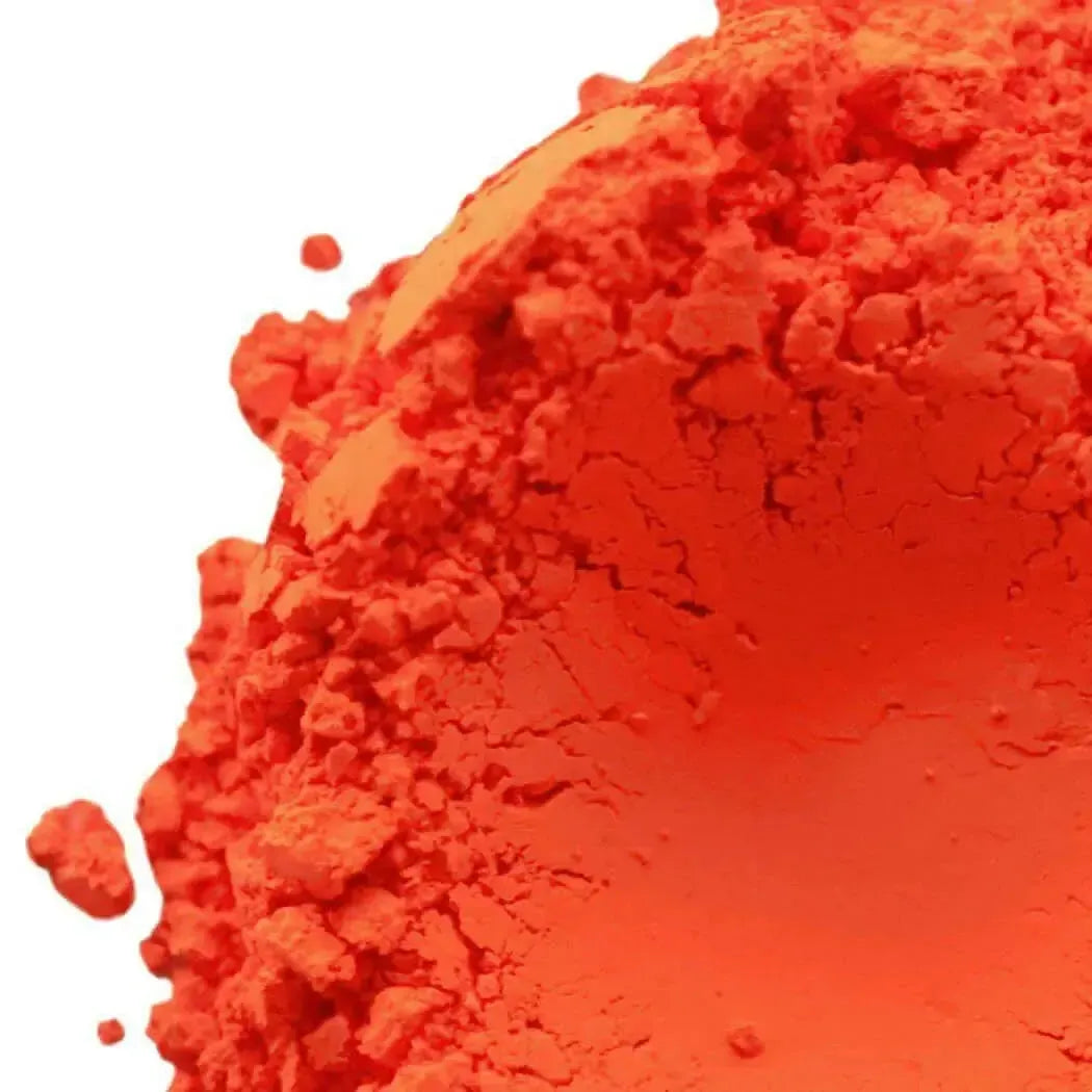 Vibrant fluorescent neon deep orange powdered pigment with fine granular texture