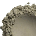 French green natural clay with gray coarse textured rough clumpy surface and visible aggregate particles