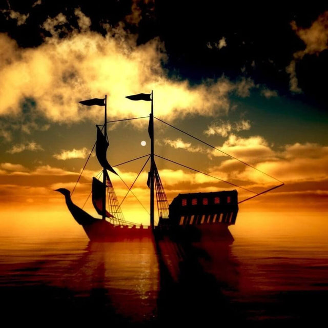 A silhouette of a traditional ship sailing during a dramatic sunset with orange and yellow skies reflected on calm waters.