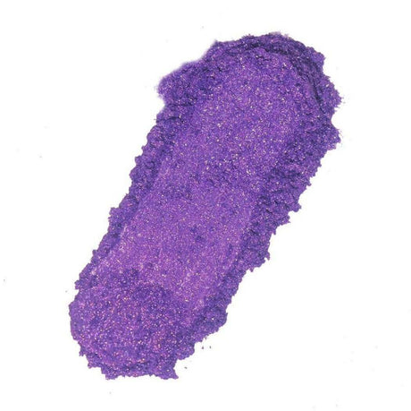 Bright purple glittery makeup smear showcasing Nurture Handmade product.