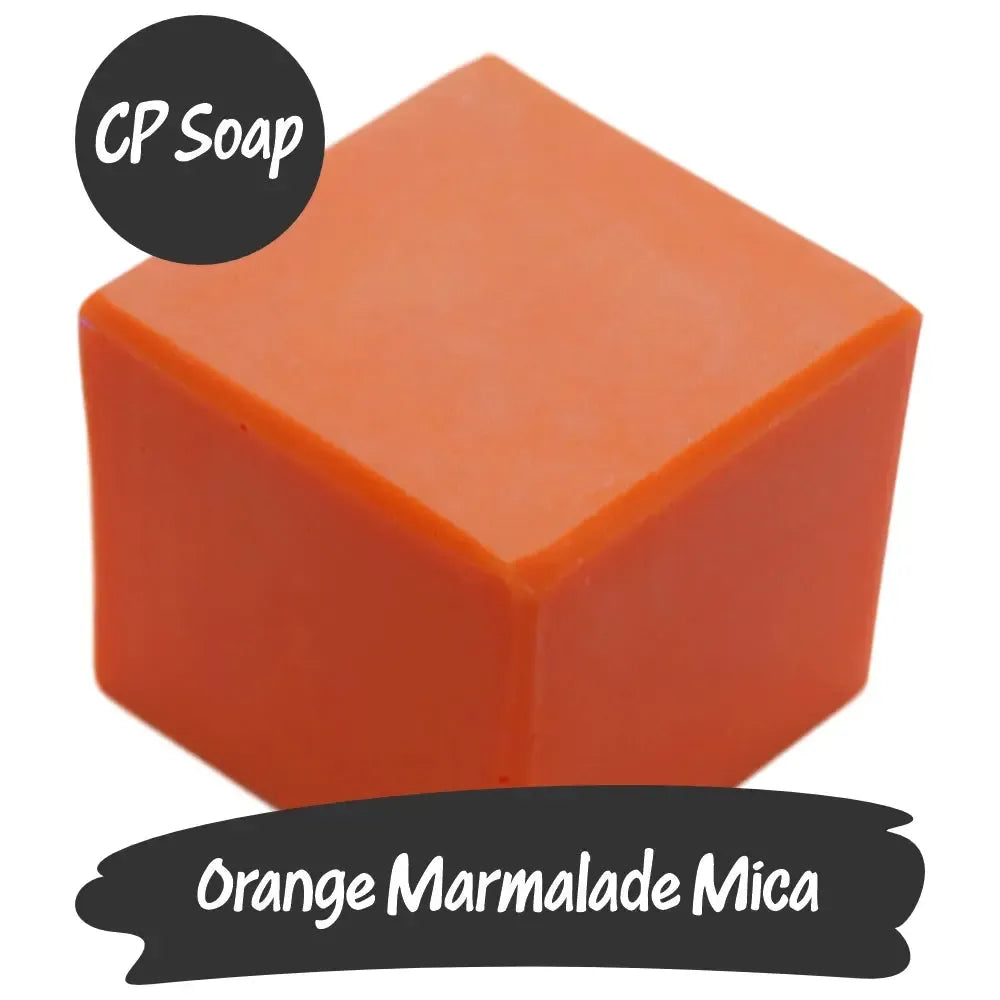 Vibrant block of Orange Marmalade Mica CP Soap, showcasing rich red-orange hues for creative projects.