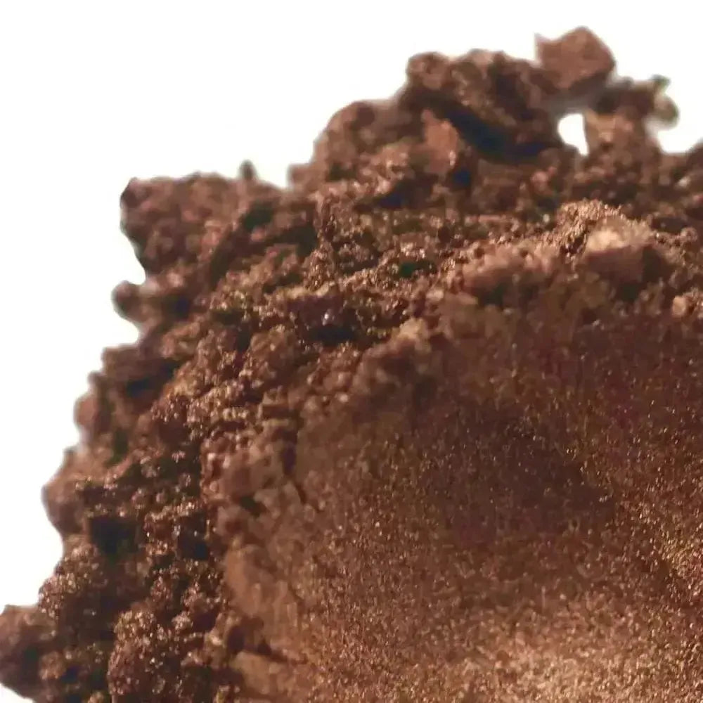 Shimmering mocha brown mica powder mound with metallic sheen