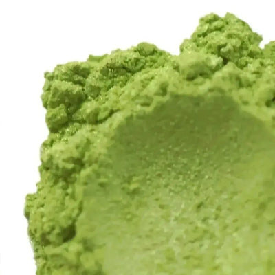 Close-up mound of bright lime green mica powder