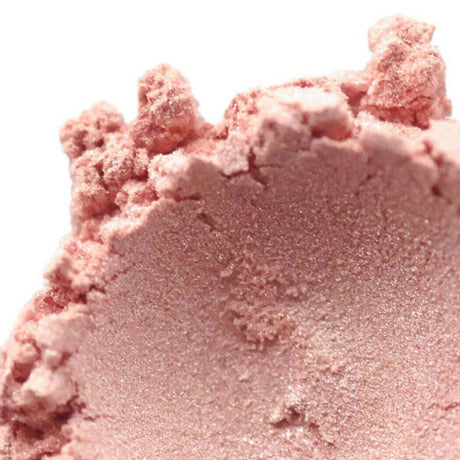 Close-up of pink powdered makeup product highlighting its texture