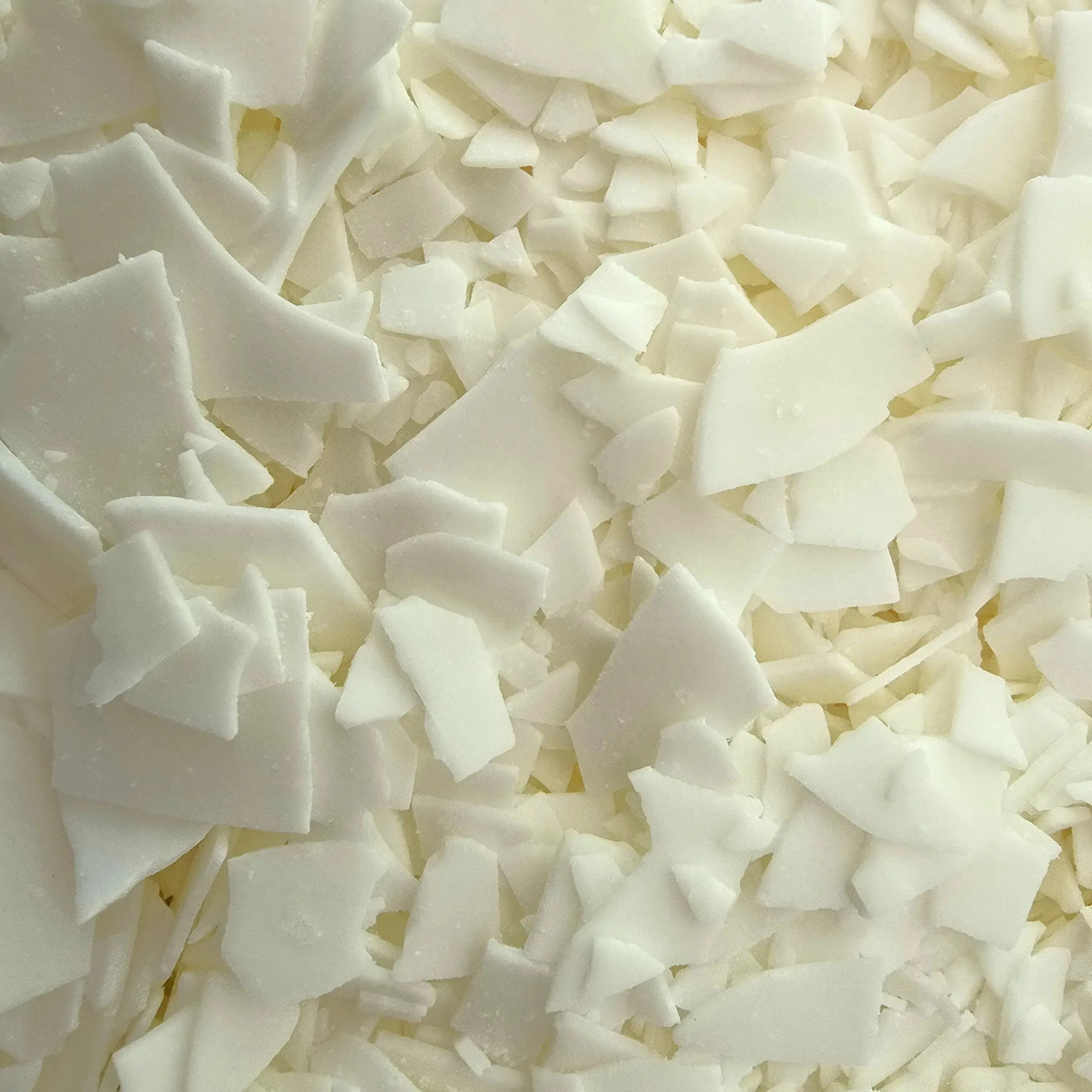 Nurture Soy Container Wax flakes in a close-up view, perfect for easy candle making and vegan-friendly.