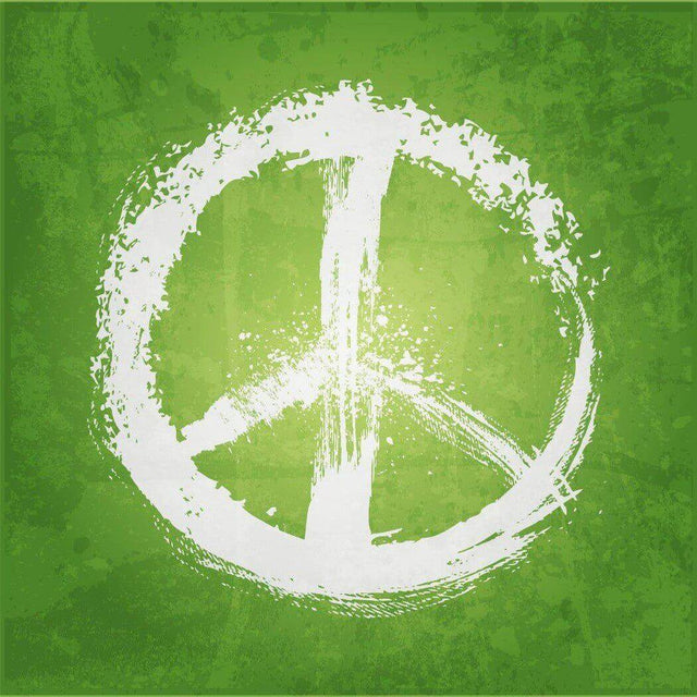 White peace sign painted on green grunge background; Nurture Handmade.