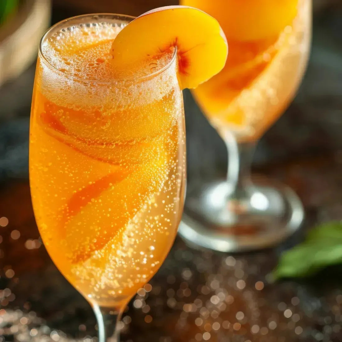 Two sparkling peach cocktails in elegant glasses, garnished with fresh peach slices, ready for a refreshing sip.