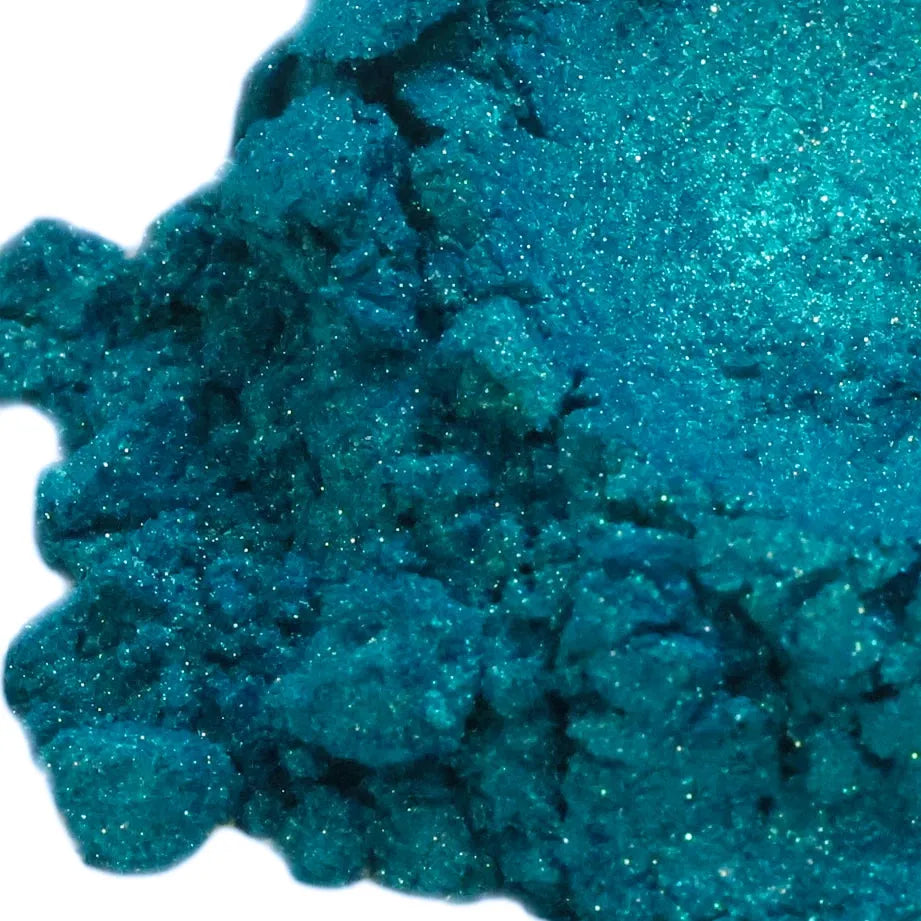 Shimmering teal Peacock Blue Green Mica glitter powder with sparkling textured surface