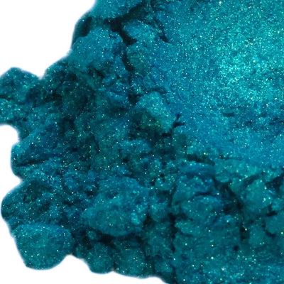 Teal blue mica powder with green sparkle and crumbled texture