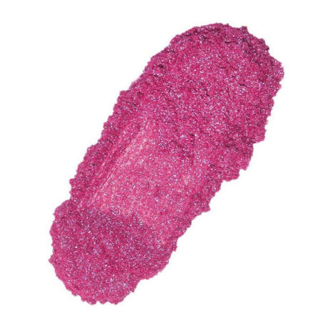 Vibrant pink glitter eye shadow smear showcasing Nurture Handmade cosmetics