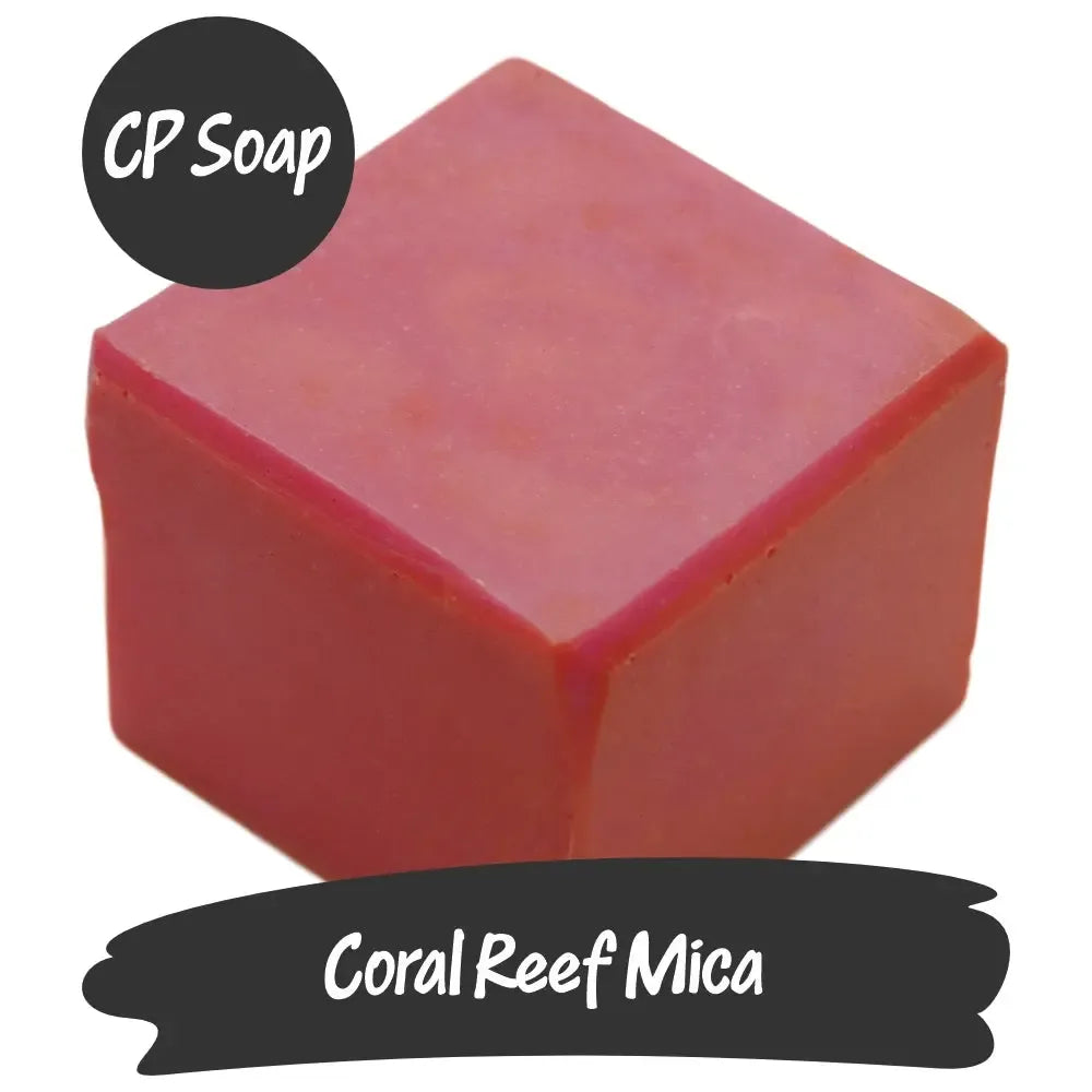 Square piece of Coral Reef Pink Mica soap showcasing its vibrant peach and pink hues, ideal for creative projects.