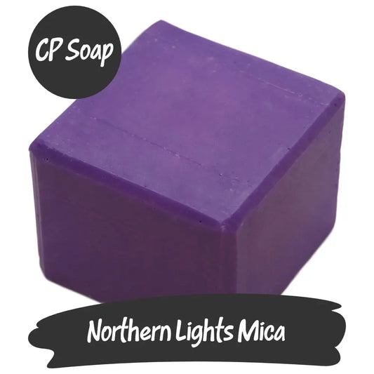 Vibrant Northern Lights Mica powder in purple soap form, perfect for adding shimmer to crafts and beauty products.