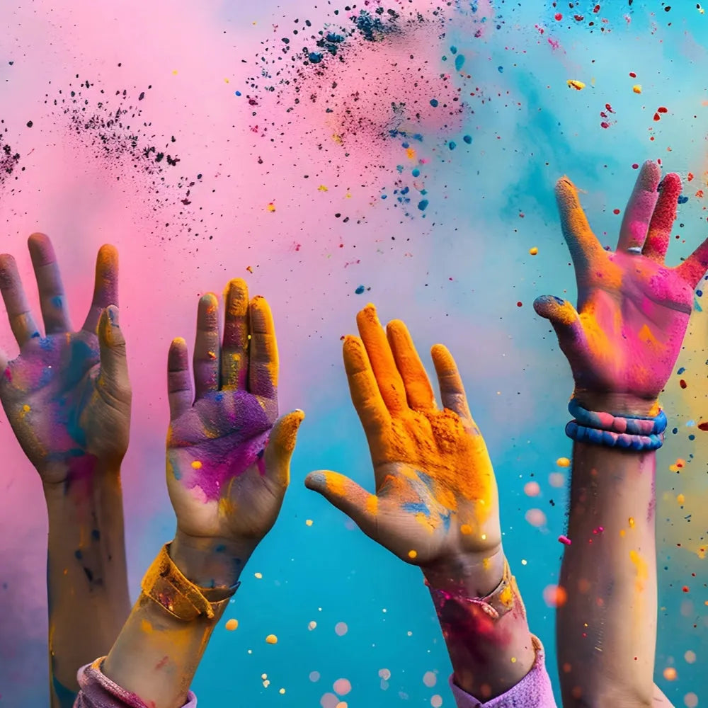 Vibrant pink, orange, purple powder-covered hands in Radiant Rebellion Mica Collection